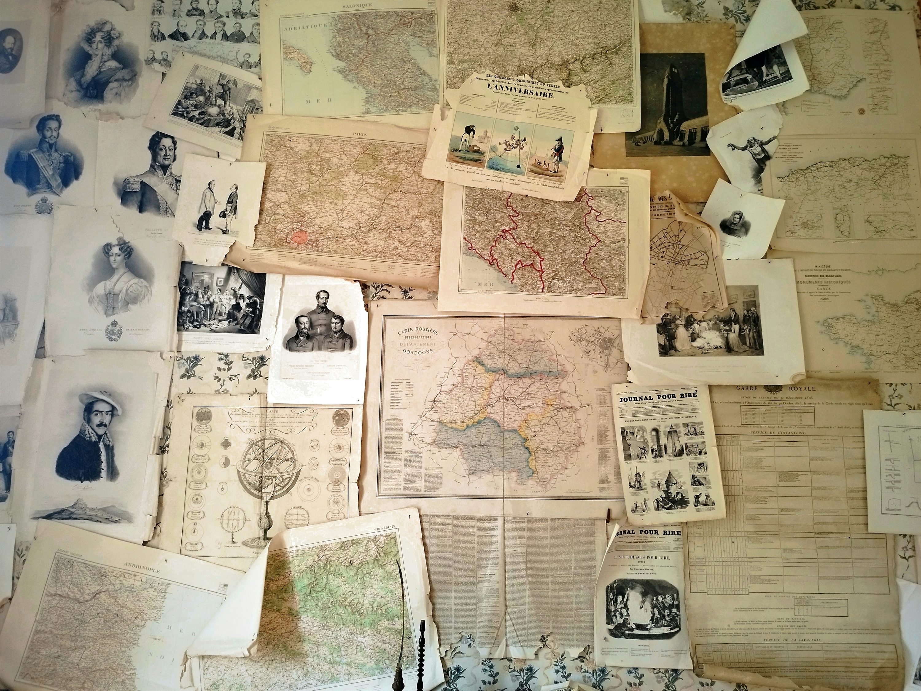 Wall of vintage maps and genealogy documents